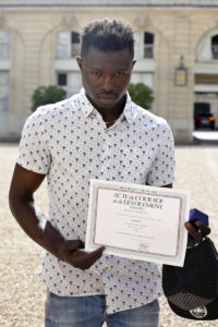 paris-hero-who-climbed-up-4-balconies-to-save-a-dangling-child-has-been-made-a-french-citizen